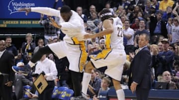 Oct 29, 2014; Indianapolis, IN, USA; Indiana Pacers coach Frank Vogel tries to avoid getting hit as forward Chris Copeland (22) and center Roy Hibbert (55) jump up to celebrate against the Philadelphia 76ers at Bankers Life Fieldhouse. Indiana defeats Philadelphia 103-91. Mandatory Credit: Brian Spurlock-USA TODAY Sports