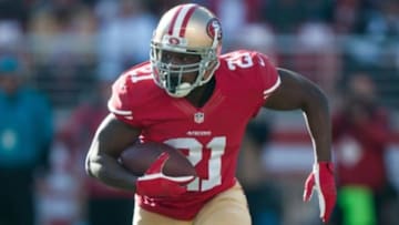 Dec 28, 2014; Santa Clara, CA, USA; San Francisco 49ers running back Frank Gore (21) runs with the ball during the first quarter of the game against the Arizona Cardinals at Levi