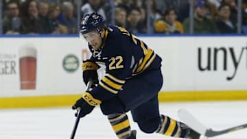 Mar 31, 2016; Buffalo, NY, USA; Buffalo Sabres left wing Johan Larsson (22) skates with the puck against the Toronto Maple Leafs during the second period at First Niagara Center. Mandatory Credit: Kevin Hoffman-USA TODAY Sports