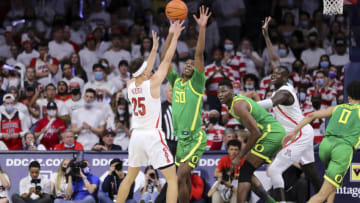 TUCSON, ARIZONA - FEBRUARY 19: Forward Eric Williams Jr. #50 of the Oregon Ducks defends guard Kerr Kriisa #25 of the Arizona Wildcats at McKale Center on February 19, 2022 in Tucson, Arizona. The Arizona Wildcats won 84-81 against the Oregon Ducks. (Photo by Rebecca Noble/Getty Images)