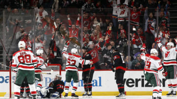 Kevin Bahl #88, Jack Hughes #86, Jesper Bratt #63, Ondrej Palat #18 and Dougie Hamilton #7 of the New Jersey Devils celebrate a goal by Hamilton as Dylan Ferguson #34 of the Ottawa Senators looks on during the third period at Prudential Center on March 25, 2023 in Newark, New Jersey. The Devils won 5-3. (Photo by Sarah Stier/Getty Images)