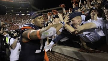 Nov 16, 2013; Auburn, AL, USA; Auburn Tigers quarterback Nick Marshall (14) celebrates with fans after the Tigers beat the Georgia Bulldogs 43-38 at Jordan Hare Stadium. Mandatory Credit: John Reed-USA TODAY Sports