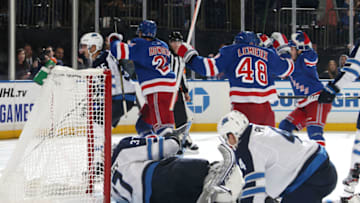 NEW YORK, NY - OCTOBER 03: Brett Howden #21, Brendan Lemieux #48 and Jacob Trouba #8 of the New York Rangers react after taking the lead in the third period against the Winnipeg Jets at Madison Square Garden on October 3, 2019 in New York City. (Photo by Jared Silber/NHLI via Getty Images)