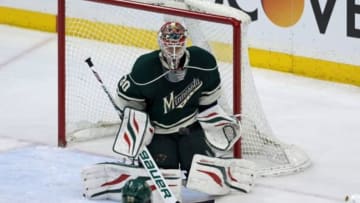 May 9, 2014; Saint Paul, MN, USA; Minnesota Wild goalie Ilya Bryzgalov (30) makes a save during the third period against the Chicago Blackhawks in game four of the second round of the 2014 Stanley Cup Playoffs at Xcel Energy Center. The Wild defeated the Blackhawks 4-2. Mandatory Credit: Brace Hemmelgarn-USA TODAY Sports