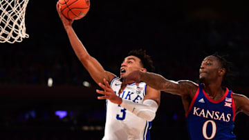 NEW YORK, NEW YORK - NOVEMBER 05: Tre Jones #3 of the Duke basketball team goes in for a layup while being guarded by Marcus Garrett #0 of the Kansas Jayhawks in the first half of their game at Madison Square Garden on November 05, 2019 in New York City. (Photo by Emilee Chinn/Getty Images)