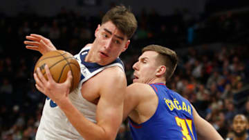 Jan 2, 2023; Minneapolis, Minnesota, USA; Minnesota Timberwolves center Luka Garza (55) works around Denver Nuggets forward Vlatko Cancar (31) in the fourth quarter at Target Center. Mandatory Credit: Bruce Kluckhohn-USA TODAY Sports