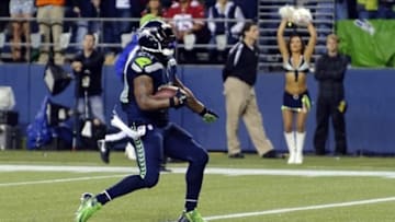 Sep 15, 2013; Seattle, WA, USA; Seattle Seahawks running back Marshawn Lynch (24) scores a touchdown during the 2nd half against the San Francisco 49ers at CenturyLink Field. Seattle defeated San Francisco 29-3. Mandatory Credit: Steven Bisig-USA TODAY Sports