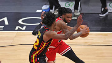 CHICAGO, ILLINOIS - DECEMBER 23: Coby White #0 of the Chicago Bulls moves against Cam Reddish #22 of the Atlanta Hawks at United Center on December 23, 2020 in Chicago, Illinois. NOTE TO USER: User expressly acknowledges and agrees that, by downloading and or using this photograph, User is consenting to the terms and conditions of the Getty Images License Agreement. (Photo by Jonathan Daniel/Getty Images)
