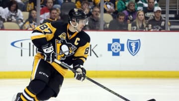 Mar 17, 2016; Pittsburgh, PA, USA; Pittsburgh Penguins center Sidney Crosby (87) skates with the puck against the Carolina Hurricanes during the third period at the CONSOL Energy Center. The Penguins won 4-2. Mandatory Credit: Charles LeClaire-USA TODAY Sports