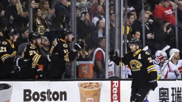 Mar 5, 2016; Boston, MA, USA; Boston Bruins center Patrice Bergeron (37) skates by the bench after scoring a goal during the first period against the Washington Capitals at TD Garden. Mandatory Credit: Bob DeChiara-USA TODAY Sports