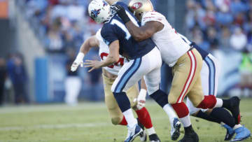 Justin Smith #94 and Ray McDonald #91 of the San Francisco 49ers pressure Jake Locker #10 of the Tennessee Titans (Photo by Michael Zagaris/San Francisco 49ers/Getty Images)