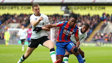 LONDON, ENGLAND - MARCH 31: Wilfried Zaha of Crystal Palace is challenged by Jordan Henderson of Liverpool and Georginio Wijnaldum of Liverpool during the Premier League match between Crystal Palace and Liverpool at Selhurst Park on March 31, 2018 in London, England. (Photo by Catherine Ivill/Getty Images)