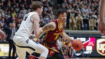 WEST LAFAYETTE, IN - FEBRUARY 03: Amir Coffey #5 of the Minnesota Golden Gophers dribbles the ball around Ryan Cline #14 of the Purdue Boilermakers during the first half at Mackey Arena on February 3, 2019 in West Lafayette, Indiana. (Photo by Michael Hickey/Getty Images)