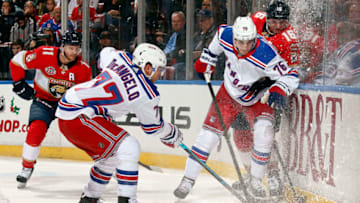 SUNRISE, FL - DECEMBER 8: Tony DeAngelo #77 and Brady Skjei #76 of the New York Rangers tangle with Aleksander Barkov #16 of the Florida Panthers at the BB&T Center on December 8, 2018 in Sunrise, Florida. (Photo by Eliot J. Schechter/NHLI via Getty Images)