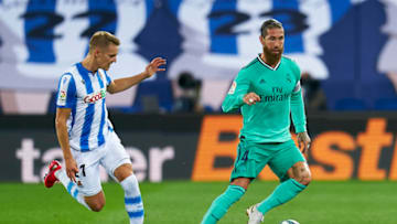 SAN SEBASTIAN, SPAIN - JUNE 21: Martin Odegaard of Real Sociedad competes for the ball with Sergio Ramos of Real Madrid during the La Liga match between Real Sociedad and Real Madrid CF at Estadio Anoeta on June 21, 2020 in San Sebastian, Spain. (Photo by Pedro Salado/Quality Sport Images/Getty Images)