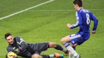 Tottenham keeper Hugo Lloris saves an attempt from Chelsea midfielder Oscar.