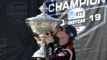 MONTEREY, CALIFORNIA - SEPTEMBER 22: Josef Newgarden #2 of United States and Hitachi Team Penske Chevrolet kisses the Astor Cup after winning the NTT IndyCar Series championship following the Firestone Grand Prix of Monterey at WeatherTech Raceway Laguna Seca on September 22, 2019 in Monterey, California. (Photo by Robert Reiners/Getty Images)