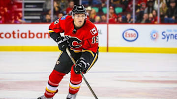 Oct 5, 2016; Calgary, Alberta, CAN; Calgary Flames left wing Matthew Tkachuk (19) controls the puck against Arizona Coyotes during the shoot out during a preseason hockey game at Scotiabank Saddledome. Calgary Flames won 2-1. Mandatory Credit: Sergei Belski-USA TODAY Sports