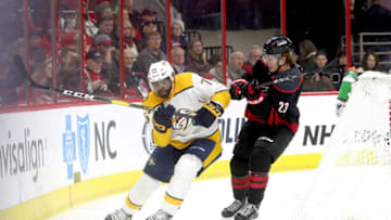 RALEIGH, NC - JANUARY 13: Brock McGinn #23 of the Carolina Hurricanes battles for a loose puck behind the net with P.K. Subban #76 of the Nashville Predators during an NHL game on January 13 ,2019 at PNC Arena in Raleigh, North Carolina. (Photo by Gregg Forwerck/NHLI via Getty Images)
