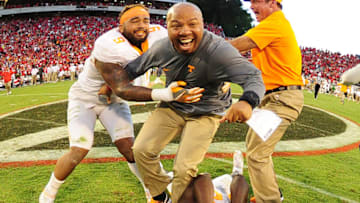 ATHENS, GA - OCTOBER 1: Assistant Coach Robert Gillespie of the Tennessee Volunteers celebrates with Justin Martin