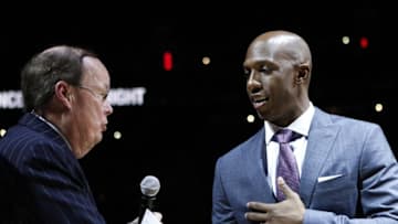 Feb 10, 2016; Auburn Hills, MI, USA; Chauncey Billups (right) shakes hands with television and radio play by play announcer George Blaha during the halftime retirement ceremony in the game between the Detroit Pistons and the Denver Nuggets at The Palace of Auburn Hills. Mandatory Credit: Raj Mehta-USA TODAY Sports