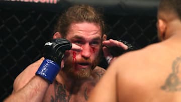 INGLEWOOD, CA - NOVEMBER 24: Tom Lawlor bleeds from the face in the first round against Deron Winn during the Light Heavyweight bout at The Forum on November 24, 2018 in Inglewood, California. (Photo by Joe Scarnici/Getty Images)