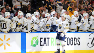 Mar 5, 2020; Buffalo, New York, USA; Buffalo Sabres defenseman Jake McCabe (19) celebrates his goal with teammates during the first period against the Pittsburgh Penguins at KeyBank Center. Mandatory Credit: Timothy T. Ludwig-USA TODAY Sports