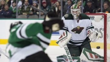 Jan 9, 2016; Dallas, TX, USA; Minnesota Wild goalie Devan Dubnyk (40) makes a save against Dallas Stars defenseman Alex Goligoski (33) during the second period at American Airlines Center. Mandatory Credit: Jerome Miron-USA TODAY Sports