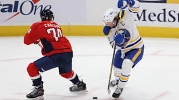 Jan 24, 2021; Washington, District of Columbia, USA; Buffalo Sabres center Jack Eichel (9) skates with the puck around Washington Capitals defenseman John Carlson (74) in overtime at Capital One Arena. Mandatory Credit: Geoff Burke-USA TODAY Sports