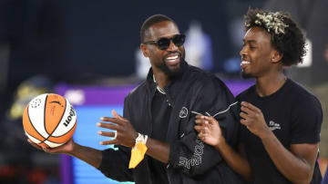 Utah Jazz co-owner Dwyane Wade and his son, Zaire Wade (Photo by Meg Oliphant/Getty Images)