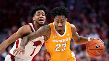FAYETTEVILLE, AR - FEBRUARY 26: Jordan Bowden #23 of the Tennessee Volunteers drives to the basket in the first half against Isaiah Joe #1 of the Arkansas Razorbacks at Bud Walton Arena on February 26, 2020 in Fayetteville, Arkansas. (Photo by Wesley Hitt/Getty Images)