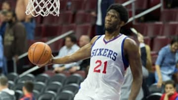 Apr 15, 2015; Philadelphia, PA, USA; Injured Philadelphia 76ers center Joel Embiid (21) dunks during warm ups before playing against the Miami Heat at Wells Fargo Center. Mandatory Credit: Bill Streicher-USA TODAY Sports