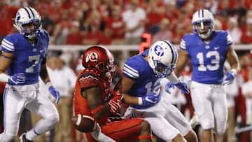 Sep 10, 2016; Salt Lake City, UT, USA; Brigham Young Cougars defensive back Kai Nacua (12) puts a hit on Utah Utes wide receiver Demari Simpkins (17) and is called for a penalty in the third quarter at Rice-Eccles Stadium. Mandatory Credit: Jeff Swinger-USA TODAY Sports