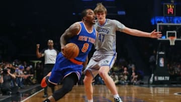 Apr 15, 2014; Brooklyn, NY, USA; New York Knicks guard J.R. Smith (8) drives past Brooklyn Nets forward Andrei Kirilenko (47) during the first quarter at Barclays Center. Mandatory Credit: Anthony Gruppuso-USA TODAY Sports