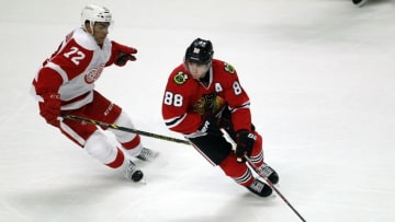 Oct 4, 2016; Chicago, IL, USA; Chicago Blackhawks right wing Patrick Kane (88) is defended by Detroit Red Wings defensemen Andreas Athanasiou (72) during the third period of a preseason game at United Center. Mandatory Credit: Caylor Arnold-USA TODAY Sports