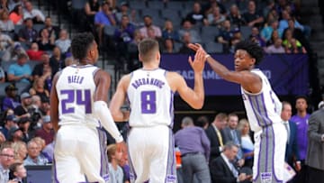 SACRAMENTO, CA - OCTOBER 2: De'Aaron Fox #5 of the Sacramento Kings high fives teammates Bogdan Bogdanovic #8 and Buddy Hield #24 during the game against the San Antonio Spurs on October 2, 2017 at Golden 1 Center in Sacramento, California. NOTE TO USER: User expressly acknowledges and agrees that, by downloading and or using this photograph, User is consenting to the terms and conditions of the Getty Images Agreement. Mandatory Copyright Notice: Copyright 2017 NBAE (Photo by Rocky Widner/NBAE via Getty Images)