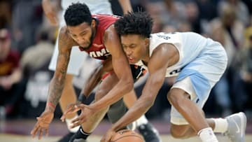 Miami Heat forward Derrick Jones Jr. (5) and Cleveland Cavaliers guard Collin Sexton (2) reach for the ball(David Richard-USA TODAY Sports)