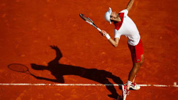 MONTE-CARLO, MONACO - APRIL 19: Novak Djokovic of Serbia serves against Dominic Thiem of Austria during his men's singles 3rd round match on day five of the Rolex Monte-Carlo Masters at Monte-Carlo Sporting Club on April 19, 2018 in Monte-Carlo, Monaco. (Photo by Julian Finney/Getty Images)