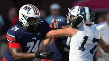 Madison-Ridgeland Academy's Jimothy Lewis, left, blocks Jackson Academy's defense during their game at Madison-Ridgeland Academy in Madison, Miss., Friday, Sept. 17, 2021.Tcl Mra Vs Ja6