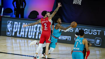 Ja Morant #12 of the Memphis Grizzlies drives to the basket against Lonzo Ball #2 of the New Orleans Pelicans (Photo by Ashley Landis - Pool/Getty Images)