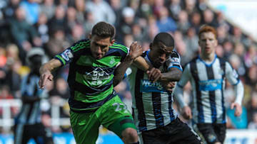 NEWCASTLE, ENGLAND - APRIL 16: Angel Rangel (L) of Swansea City tussles with Georginio Wijnaldum (R) of Newcastle during the Barclays Premier League match between Newcastle United and Swansea City at St.James' Park on April 16, 2016, in Newcastle upon Tyne, England. (Photo by Serena Taylor/Newcastle United via Getty Images)