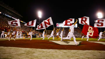 Sep 13, 2014; Norman, OK, USA; Oklahoma Sooners cheerleaders run onto the field with flags during the game against the Tennessee Volunteers at Gaylord Family - Oklahoma Memorial Stadium. Mandatory Credit: Kevin Jairaj-USA TODAY Sports