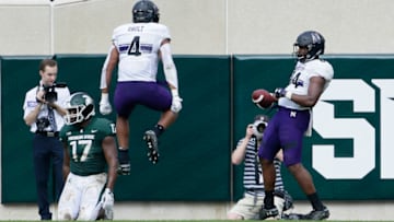 EAST LANSING, MI - OCTOBER 6: Wide receiver Cameron Green #84 of the Northwestern Wildcats celebrates his touchdown against linebacker Tyriq Thompson #17 of the Michigan State Spartans with wide receiver Solomon Vault #4 of the Northwestern Wildcats during the second half at Spartan Stadium on October 6, 2018 in East Lansing, Michigan. Northwestern defeated Michigan State 29-19. (Photo by Duane Burleson/Getty Images)