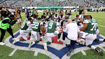 EAST RUTHERFORD, NJ - OCTOBER 15: Members of the New England Patriots and New York Jets (Photo by Abbie Parr/Getty Images)