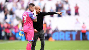 LONDON, ENGLAND - AUGUST 10: Pep Guardiola, Manager of Manchester City speaks with Ederson of Manchester City after the Premier League match between West Ham United and Manchester City at London Stadium on August 10, 2019 in London, United Kingdom. (Photo by Laurence Griffiths/Getty Images)