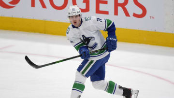 Apr 29, 2021; Toronto, Ontario, CAN; Vancouver Canucks forward Kole Lind (78) shoots the puck against Toronto Maple Leafs in the second period at Scotiabank Arena. Mandatory Credit: Dan Hamilton-USA TODAY Sports