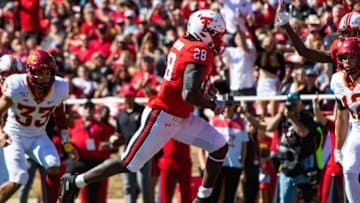 LUBBOCK, TEXAS - OCTOBER 19: Running back SaRodorick Thompson #28 of the Texas Tech Red Raiders runs for a touchdown during the first half of the college football game against the Iowa State Cyclones on October 19, 2019 at Jones AT&T Stadium in Lubbock, Texas. (Photo by John E. Moore III/Getty Images)