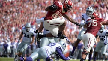 Oct 15, 2016; Norman, OK, USA; Oklahoma Sooners running back Joe Mixon (25) hurdles Kansas State Wildcats defensive back Dante Barnett (22) to score a touchdown during the first quarter at Gaylord Family - Oklahoma Memorial Stadium. Mandatory Credit: Mark D. Smith-USA TODAY Sports