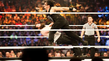 NEW YORK, NY - AUGUST 23: Roman Reigns on the attack at the WWE SummerSlam 2015 at Barclays Center of Brooklyn on August 23, 2015 in New York City. (Photo by JP Yim/Getty Images)