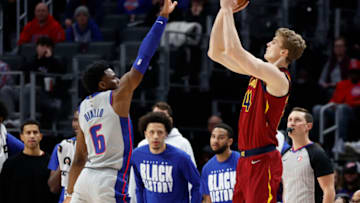 Feb 24, 2022; Detroit, Michigan, USA; Cleveland Cavaliers forward Lauri Markkanen (24) shoots on Detroit Pistons guard Hamidou Diallo (6) in the second half at Little Caesars Arena. Mandatory Credit: Rick Osentoski-USA TODAY Sports